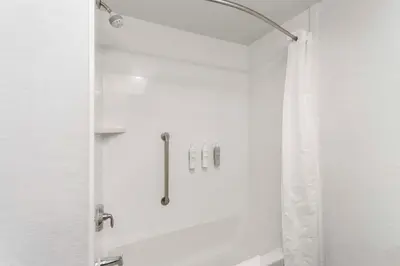a bathroom with a shower with a shower curtain at Hampton Inn & Suites Columbus Scioto Downs in Columbus