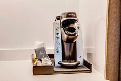 a coffee maker in a box on a shelf at SpringHill Suites by Marriott Dayton Vandalia in Murlin Heights