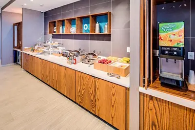 a cafeteria with a counter with food on it at SpringHill Suites by Marriott Dayton Vandalia in Murlin Heights