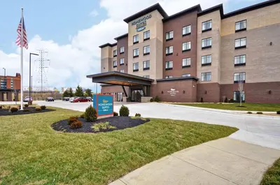 a hotel with a sign in front of a building at Homewood Suites by Hilton Cincinnati/West Chester in West Chester