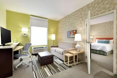 a hotel room with a bed and a desk at Home2 Suites by Hilton Cleveland Independence in Independence