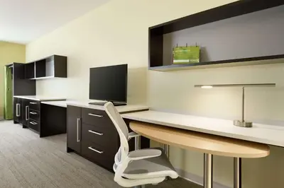 an office with a desk with a computer and a chair at Home2 Suites by Hilton Cleveland Independence in Independence