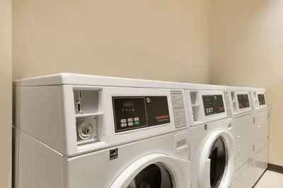 a white washer and dryer in a room at Home2 Suites by Hilton Cleveland Independence in Independence