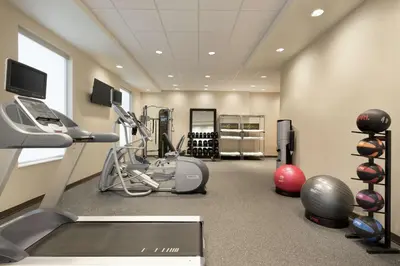 a room with a gym with a treadmill and exercise equipment at Home2 Suites by Hilton Cleveland Independence in Independence