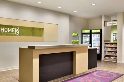 a store lobby with a fireplace in a store at Home2 Suites by Hilton Cleveland Independence in Independence