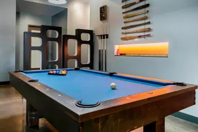 a pool table in a room with a pool table at Aloft Newport on the Levee in Newport