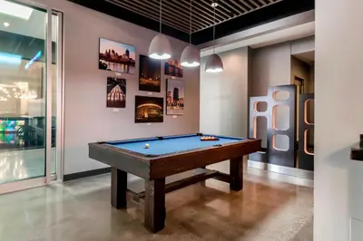 a room with a pool table in it at Aloft Newport on the Levee in Newport