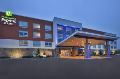 an exterior view of a hotel with a building at Holiday Inn Express & Suites - Parkersburg East by IHG in Parish-Morris Subdivision