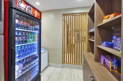 a refrigerator filled with lots of drinks in a store at Holiday Inn Express & Suites - Parkersburg East by IHG in Parish-Morris Subdivision
