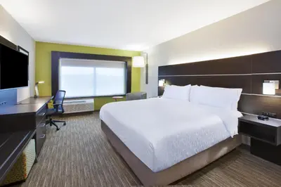a hotel room with a large bed and a television at Holiday Inn Express & Suites - Parkersburg East by IHG in Parish-Morris Subdivision