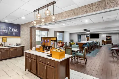 a lobby of a hospital with a dining room at Hampton Inn University Area, Huntington, Wv in Huntington