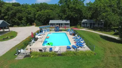 an overhead view of a swimming pool with lounge chairs at Bird's Nest Resort in Put-in-Bay