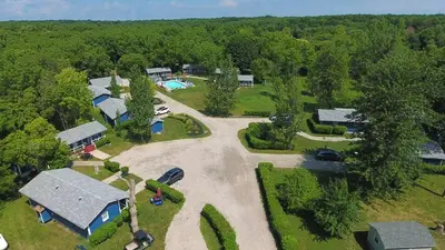 an aerial view of a house with a driveway and a yard at Bird's Nest Resort in Put-in-Bay