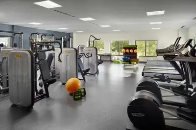 a gym with cardio machines and an orange on the floor at Residence Inn by Marriott Columbus OSU in Columbus