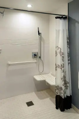 a bathroom with a shower curtain and a toilet at Residence Inn by Marriott Columbus OSU in Columbus