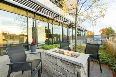 a patio with two chairs and a fire pit at Residence Inn by Marriott Columbus OSU in Columbus