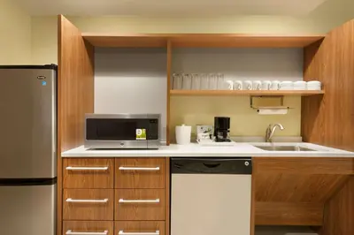 a small kitchen with a sink and a microwave at Home2 Suites By Hilton Middleburg Heights Cleveland in Middleburg Heights