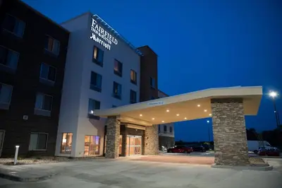 a hotel building with a parking lot in front of it at Fairfield Inn & Suites by Marriott Anderson in Anderson