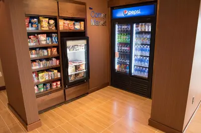 a grocery store aisle with a refrigerator and drinks at Fairfield Inn & Suites by Marriott Anderson in Anderson
