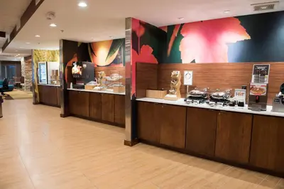 a lobby with a counter with many items on display at Fairfield Inn & Suites by Marriott Anderson in Anderson