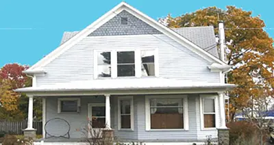 a white house with a window on top of it at Aunt Jane's Two in Put-in-Bay