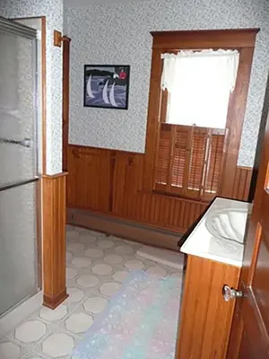 a kitchen with a sink and a window and a refrigerator at Aunt Jane's Two in Put-in-Bay