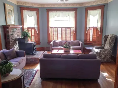 a living room with a couch and two chairs and a tv at Aunt Jane's Two in Put-in-Bay