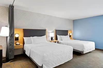 a hotel room with two beds and two lamps at Home2 Suites By Hilton Youngstown in Youngstown