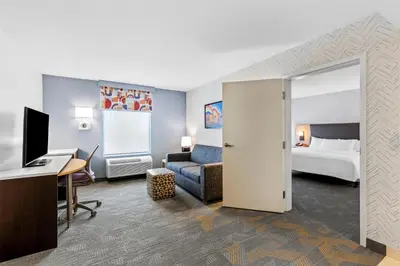 a hotel room with a bed and a desk at Home2 Suites By Hilton Youngstown in Youngstown