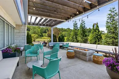 a patio with chairs and a fire pit at Home2 Suites By Hilton Youngstown in Youngstown