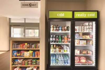 two refrigerators in a store with food and drinks at Home2 Suites By Hilton Columbus Dublin in Dublin