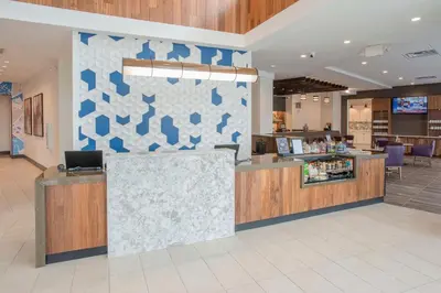 a lobby with a counter in a store at Hyatt Place Cincinnati/Sharonville Convention Center in Sharonville