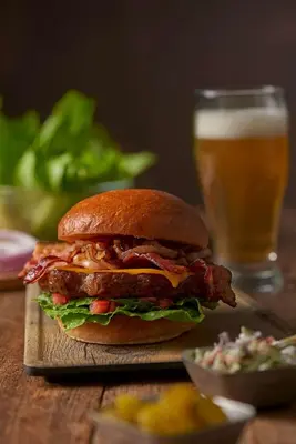 a sandwich on a table with a glass of beer at Hyatt Place Cincinnati/Sharonville Convention Center in Sharonville