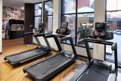 a row of treadmills in a gym at Hotel Indigo Cleveland Downtown by IHG in Cleveland