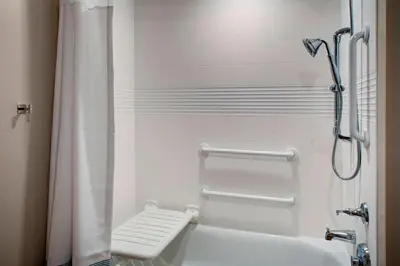 a bathroom with a shower with a shower curtain at TownePlace Suites by Marriott Parkersburg in Parkersburg