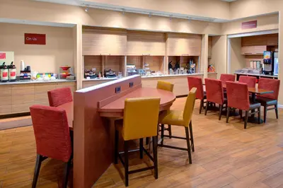 a dining room with a table and chairs at TownePlace Suites by Marriott Parkersburg in Parkersburg