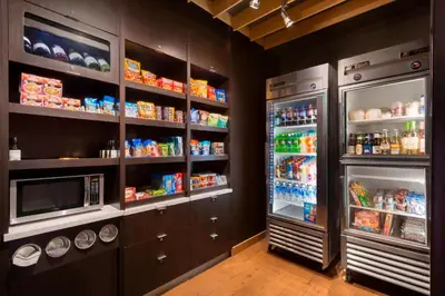 a kitchen with two large refrigerators at Courtyard Akron Fairlawn in Montrose