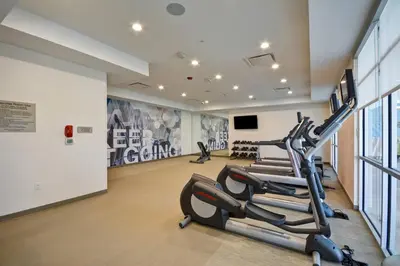 a gym with cardio equipment in a building at SpringHill Suites by Marriott Cincinnati Blue Ash in Blue Ash