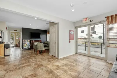 an open living room with a kitchen and a dining room at Grove City Travel Inn South Columbus in Grove City