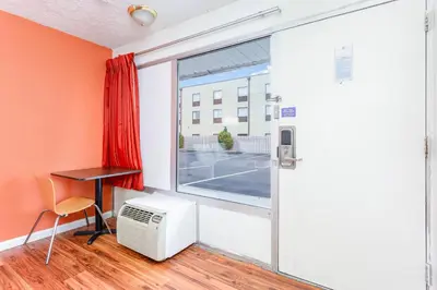 a room with a window and a desk and a heater at Relax Inn by OYO Columbus OH I 70 in Columbus
