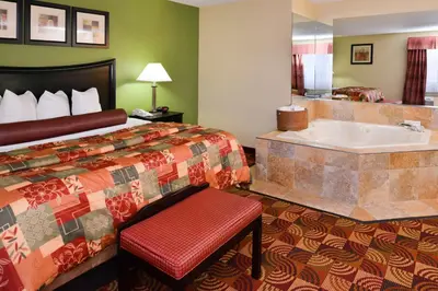 a hotel room with a bed and a bath tub at Best Western Canal Winchester Inn-Columbus South East in Canal Winchester