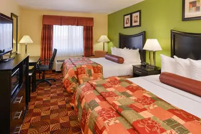 a hotel room with two beds and a desk at Best Western Canal Winchester Inn-Columbus South East in Canal Winchester
