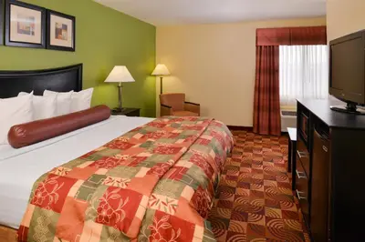 a hotel room with a bed and a flat screen tv at Best Western Canal Winchester Inn-Columbus South East in Canal Winchester