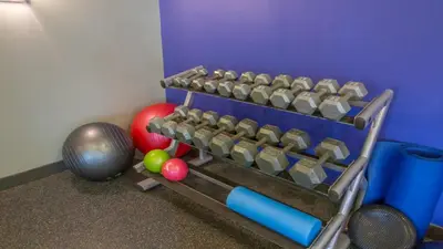 a toy gym with dumbbells and balls on the floor at Holiday Inn Express Columbus Airport Easton in Columbus