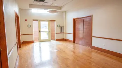 an empty room with wooden floors and a door at Holiday Inn Express Columbus Airport Easton in Columbus