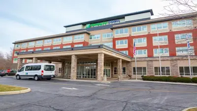 a van parked in front of a building at Holiday Inn Express Columbus Airport Easton in Columbus