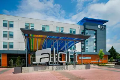 a building with a sign in front of it at Aloft Columbus Westerville in Westerville