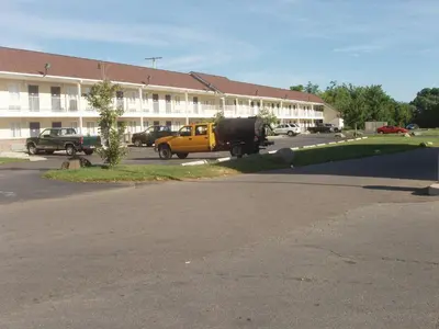 a yellow truck parked in front of a building at Kozy Inn Columbus in Columbus