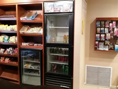 a refrigerator with its door open in a room at Hawthorn Extended Stay by Wyndham Columbus in Columbus
