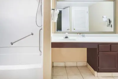 a bathroom with a sink and a mirror at Hawthorn Extended Stay by Wyndham Columbus in Columbus